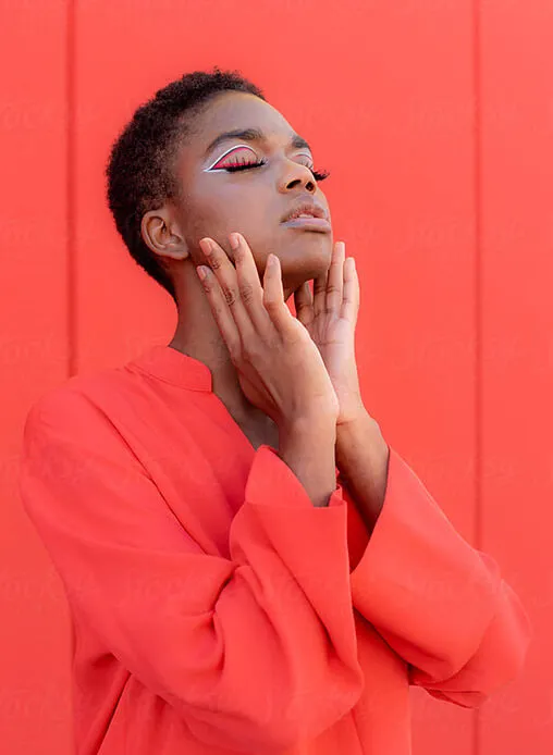 A model with creative, artistic eye makeup, demonstrating a bold approach to beauty brand visual identity.