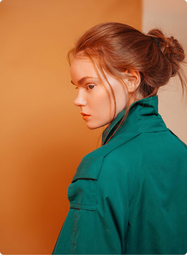 An editorial style portrait of a model, representing the intersection of fashion and beauty for high-end brand campaigns.