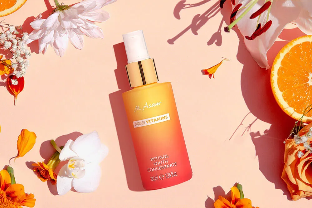 Natural skincare banner design featuring a rejuvenating serum, styled with fresh flowers and natural elements to highlight its vitamin-rich properties.